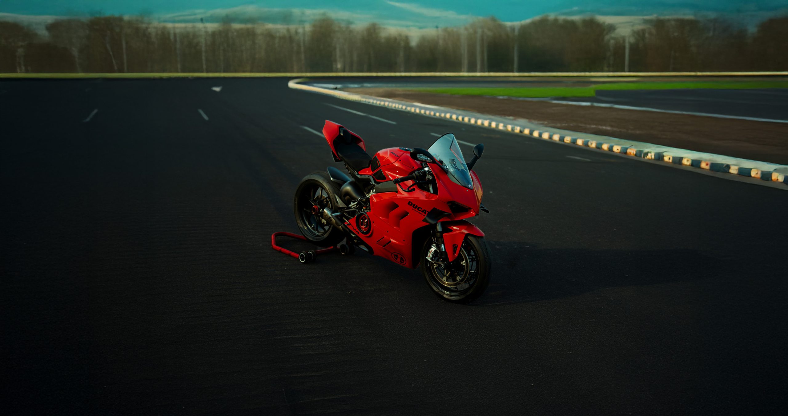 Red Pangiale V4 on a track
